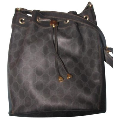 For sale is a Gucci, grey Guccissima print on black coated canvas and black leather, large, bucket: For sale is a Gucci, grey Guccissima print on black coated canvas and black leather, large, bucket bag with red and green accents attaching the strap, a drawstring top closure, and gold hardware! This