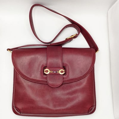 For sale is an early, RARE, Gucci, burgundy buttery soft leather, two way shoulder bag with a GG: For sale is an early, RARE, Gucci, burgundy buttery soft leather, two way shoulder bag with a GG clasp in gold & enamel at the center, an accordion bottom, and an adjustable strap! This high end p