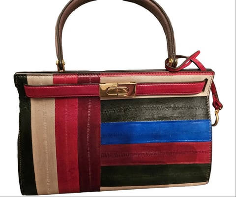 For sale is a Tory Burch Lee Radziwill, multicolored eel skin leather Birkin style two way Kelly bag: For sale is a Tory Burch Lee Radziwill, multicolored eel skin leather Birkin style two way Kelly bag with gold hardware, a footed bottom, removable strap, & timeless style!Discover the epitome of