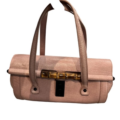 For sale is an authentic, Gucci, pink textured leather, large, two strap, bamboo accent, bullet bag! (1 of 4)