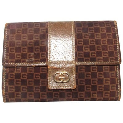 For sale is a unique, vintage, Gucci, RARE, wallet made of brown square G logo print suede and brown: For sale is a unique, vintage, Gucci, RARE, wallet made of brown square G logo print suede and brown leather with gold hardware, a kiss closure change purse, slots for cards and cash, and a gold engra
