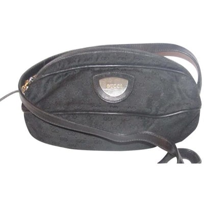 For sale is an unusual, early Gucci, black micro Guccissima print canvas and black leather, football: For sale is an unusual, early Gucci, black micro Guccissima print canvas and black leather, football shaped cross body or shoulder purse with black leather piping giving the canvas body the appearance