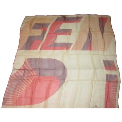 For sale is a NWOT, Fendi, unique, large logo print, 35" square, 100% sheer silk chiffon scarf in: For sale is a NWOT, Fendi, unique, large logo print, 35" square, 100% sheer silk chiffon scarf in shades of pink, coral, and plum with an image of the FENDI letters in color block at the center on an