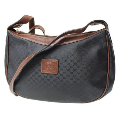 * For sale is a Gucci, black micro Guccissima print coated canvas and brown leather, hobo style: * For sale is a Gucci, black micro Guccissima print coated canvas and brown leather, hobo style purse! This is a great looking piece from Gucci with a timeless style! The purse is a large, top zip, ho