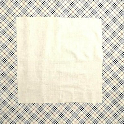 For sale is a Burberry Haymarket Nova Check print, 22" square/34" diagonal, silk and cotton scarf in: For sale is a Burberry Haymarket Nova Check print, 22" square/34" diagonal, silk and cotton scarf in red, white, tan, and black with rolled edges, a 4" plaid border, and a subtle stitched floral desig