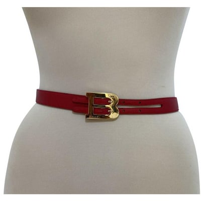 Bally Red W Gold B Buckle Leather Belt: For sale is a Bally, red leather, 32" long, belt with a gold 'B' logo, dual prong buckle, three spaces from 28" to 30", and a fun, funky style! The piece is chic, edgy, and would look great all year l