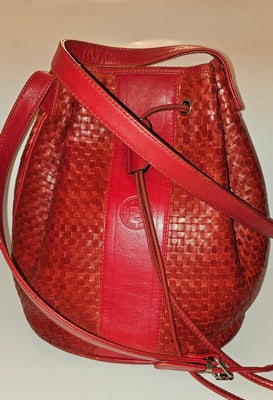 Fendi Red Intrecciato Leather Crossbody Bucket Bag: One of a kind Fendi style! For sale is a vintage, Fendi, unique, true red, intrecciato or woven leather, drawstring top, cross body, bucket shaped satchel, with engraved, antique gold finish hardware!