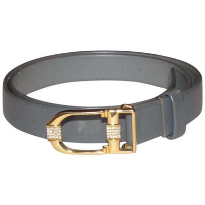 Dior Grey Leather Belt With CD Buckle w Crystals: For sale is a RARE, Christian Dior, grey leather belt with a gold 'CD' logo buckle, clear Swarovski crystals, a hook that slides into a hole in the leather to secure it, and three holes that snap into