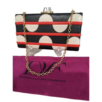 DVF eel & python double-sided two-way clutch w mod print: For sale is a unique, Diane von Furstenburg, eel & python, double-sided, two-way clutch with a red, white, & blue, geometric mod print on one side in eel skin leather and the other side a soli