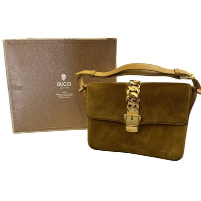 RARE, Gucci, 1975 Sylvie yellow leather & suede, shoulder bag with an adjustable strap, a bold gold: ONE OF A KIND, VINTAGE FIND! For sale is a RARE, Gucci, 1975 Sylvie yellow leather & suede, shoulder purse with an adjustable strap, a bold gold zipper accent down the center and as the locking cl