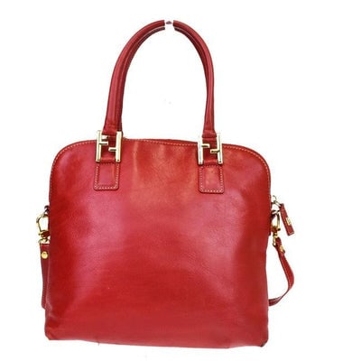 Fendi, '2 Mancini' style, true red leather, two-way satchel style purse: For sale is a new old stock, Fendi, '2 Mancini' style, true red leather, two-way satchel style purse with a removable shoulder strap, bold gold hardware, two rolled leather handles, and the original
