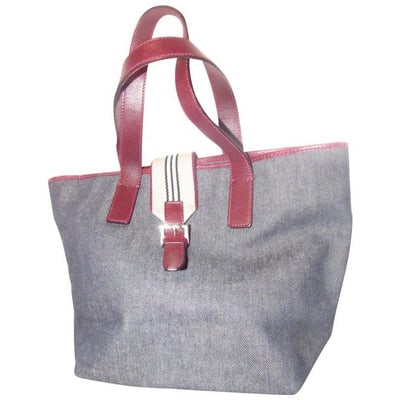 Burberry Bucket Style Dark Rinse Denim And Burgundy Leather Satchel: For sale is a Burberry, dark rinse denim and burgundy leather, bucket style satchel with a wide, tan/black/ivory/maroon striped canvas wrap around snap closure, two handles, a tapered bucket shape, an