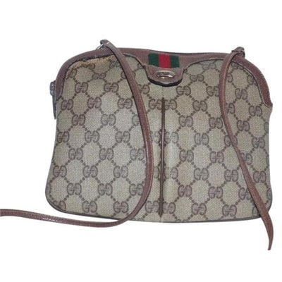 Gucci Vintage Brown Large G Logo Print Coated Canvas And Brown Leather: For sale is a vintage, Gucci Accessory Collection, brown Guccissima print coated canvas and brown leather in a rounded rectangular shape, cross body/shoulder bag with red/green striped accent, top zip