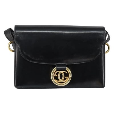 Gucci Black Leather Torchon Cross Body w Bold Gold GG Medallion: For sale is an early Gucci Black Leather Torchon cross body style purse with bold gold hardware, a GG medallion, lots of interior pockets, and fabulous mid century mod style.Own a piece of fashion his