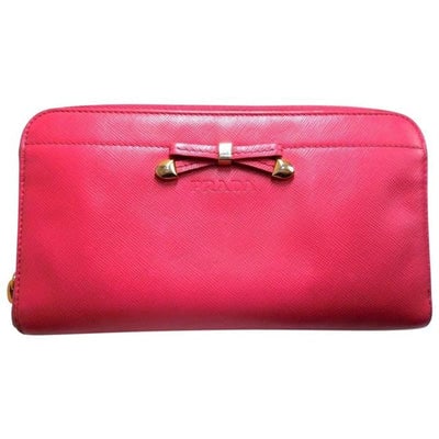 Prada Rose Colored Saffiano Leather Wallet: For sale is a PRADA, rose red colored saffiano leather, zip around style, extra large wallet with lots of small and large compartments, zip pockets, lots of card slots, and a petite leather and gold t