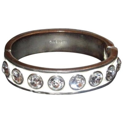 Givenchy Silver Ivory Swarovski Crystals Bracelet: For sale is a Givenchy, silver and ivory enamel, bangle style bracelet with large Swarovski crystals and a hidden hinged clasp! The bracelet is gorgeous and unique! It is a classic, chunky bangle styl