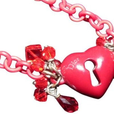Dior Resin Link Necklace w Puffed Heart Dior Charm & Faceted Glass Beads: Christian Dior, 18" long necklace made from interlocking, round, resin links with a large dimensional resin heart pendant at the center , clusters of s on both sides of it, a silver clasp closure, a 3