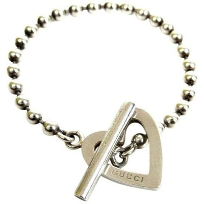 Gucci Sterling Silver Open Heart Charm Bracelet: For sale is a Gucci, sterling silver, AMAZING, substantial, 7" long bracelet with a large, 1" in diameter, open heart shaped charm, a round, beaded link, a toggle style clasp, and 'GUCCI' engraved on 