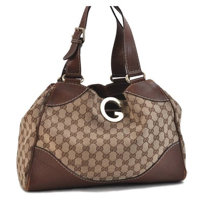 Gucci 'Charlotte' brown Guccissima XL satchel w chrome G: For sale is a rare, Gucci, 'Charlotte' style brown Guccissima print canvas and leather, XL top handle satchel or tote style bag with a chrome G accent at the center, a top snap closure, and bold