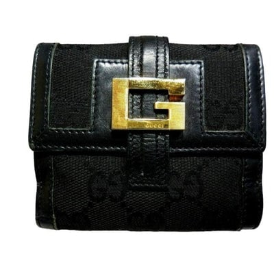 Gucci Black G Logo Leather Tom Ford Era Bi Fold Style Wallet: For sale is a Gucci, black Guccissima print canvas and black leather, snap close, bi-fold wallet with an XL gold square G logo accent, a snap close change purse, and lots of slots for your cards! This