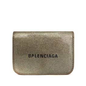 Balenciaga, gold leather wallet with two compartments and a snap close change purse & tri-fold