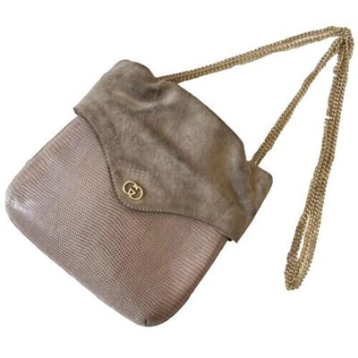 Gucci honey lizard leather bucket bag with gold chain strap: For sale is a one of a kind, taupe, reptile skin leather and suede, hard & boxy, two way, clutch or cross body bucket bag with a removable, gold chain strap and gold GG accent. This is a completel