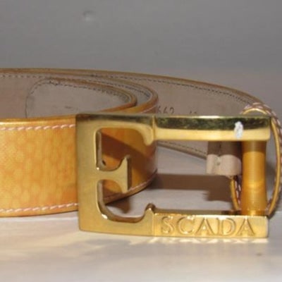 Escada Gold Patent Leather Gold 'E' Buckle Belt: Escada, gold marbled patent leather, belt that measures 37" long x 1.25" wide with holes at 31", 32", and 33", with a rectangular, bold gold, engraved, 'E' Escada buckle! This unique, limited edition