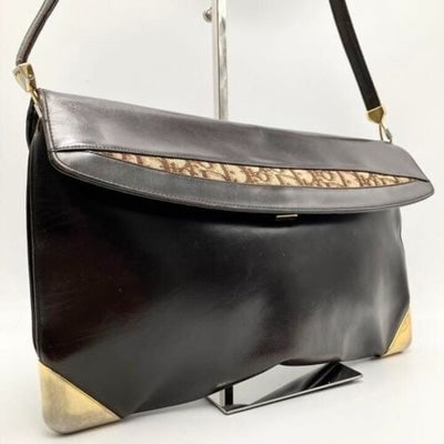 RARE, vintage, Dior, brown leather two-wy clutch/shoulder bag with a brown trotter print interior: For sale is a RARE, vintage, Dior, brown leather two-wy clutch/shoulder bag with a brown trotter print interior and accent that peeks through the front, a hard, boxy shape, multiple pockets, bold bras