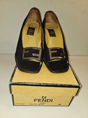 Fendi 'dress nero' black open toe heels w chrome FF accents!: Step into timeless elegance with these stunning Fendi black open toe heels, a sophisticated choice for any occasion.Crafted with meticulous attention to detail, these heels feature the iconic chrome F