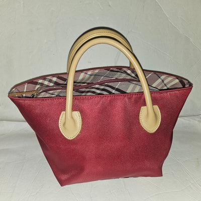 Burberry burgundy & Nova Check fabric zip top tote with tan leather handles: For sale is a graduated, collapsible Burberry burgundy & Nova Check fabric zip top tote with tan leather rolled handles. It is a great year round travel bag.Dimensions: 13" x 6.5" x 6 ; Handle dro