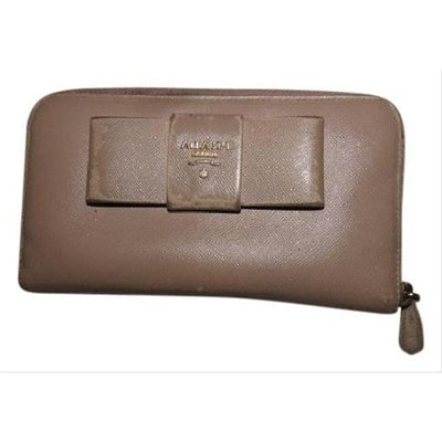 Prada Pale Pink Nude Leather Wallet: For sale is a PRADA, nude-pale pink leather, zip around style, extra large wallet with lots of small and large compartments, zip pockets, lots of card slots, & a bow accent! This is a great lookin