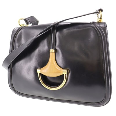 Vintage, navy leather, Gucci shoulder bag with XL gold & tan leather horsebit accent with cut-out &: For sale is a vintage, very rare, navy blue leather, Gucci horsebit cut-out, shoulder bag with large, gold and tan leather horsebit accent with 'GUCCI' engraved across the top of it, and multiple