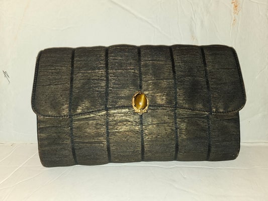 Gucci early black & gold silk taffeta with tiger's eye in 14K clasp: For sale is a 1950s Gucci early black & gold silk taffeta with an oval tiger's eye bezel set in 14K gold hinged clasp