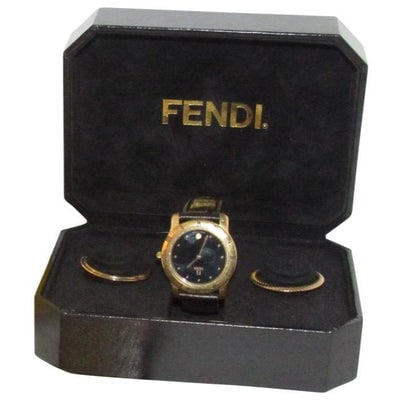Fendi Brown Leather Round Gold Bezel Jewelry And Watch Combo: For sale is a Swiss made, Limited Edition, Fendi 810G watch with a black face, brown leather textured Fendi band, simple gold dots as hour markers/numerals on the face, and three different bezels with