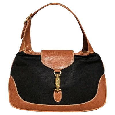 Original Gucci, 1961 Jackie hobo style shoulder bag, made in black linen canvas & camel leather with: For sale is an extra large, original Gucci, 1961 Jackie hobo style shoulder bag, made in hard to find, black linen canvas and camel color leather with a gold piston closure! It is a unique version of 