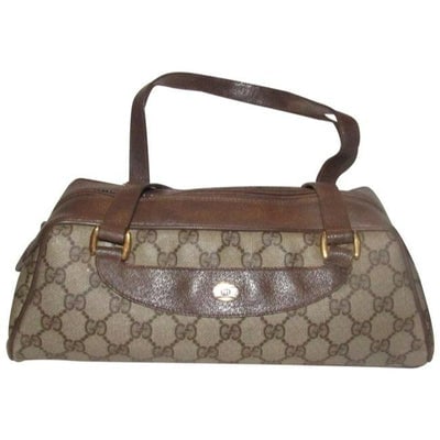Gucci Vintage Purses Brown Large G Logo Print Coated Canvas And Brown Leather Satchel: For sale is a Gucci, RARE, brown Guccissima print coated canvas and brown leather, large, satchel/ Boston bag in long the 'bullet' shape with gold hardware and a unique, angular shape! This is a rare 