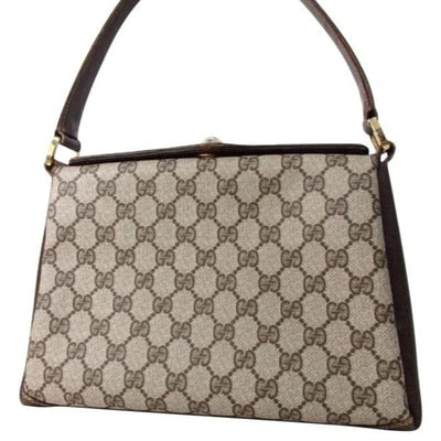 Gucci Bag Guccissima Boxy Top Handle Purse Brown G Print Gold Leather And Coated Canvas: For sale is a vintage, designer, 1960's mod, Gucci, large brown G logo print coated canvas and brown leather, gold tone, twist top closure, roomy, multi-compartment, shoulder purse with one strap leng