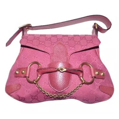 Gucci pink Guccissima leather Horse-bit chain saddle bag: RE- RELEASED BY GUCCI! For sale is a Gucci, pink leather and pink Guccissima print canvas, satchel/bucket Horse-bit chain saddle bag with bold gold, equestrian accents at center! It is a rare style an
