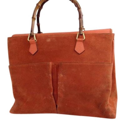 Gucci Orange Suede Bamboo Line Two Way Satchel w Pockets: Gucci has re-released very similar styles in its newest line!* For sale is a Gucci, mod look, deep burnt orange suede and leather, two-way: tote or satchel with two bamboo handles, a footed bottom, re