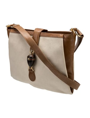 Gucci canvas & camel leather early Jackie with amazing piston clasp: For sale is an exceptional vintage Gucci Jackie in canvas and supple camel leather, a timeless silhouette that defined luxury handbag design. This early iteration features the brand's iconic XL wood p