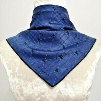 Burberry Blue Black Plaid Jacquard Nova Check Print Silk Scarf: For sale is a nwot, unique, Burberry, marquis logo knight print and plaid jacquard print, 24" square/36" diagonal, 100% silk scarf in navy, turquoise, and black with rolled edges and classic Burberry 