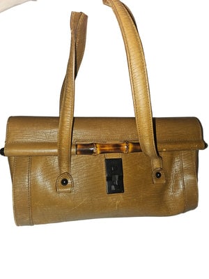 Gucci brown leather bamboo bullet bag!: For sale is an authentic, Gucci, brown textured leather, large, two strap, bamboo accent, bullet bag! One of Gucci's most desirable and classic purse designs with timeless style! This is a fabulous, G