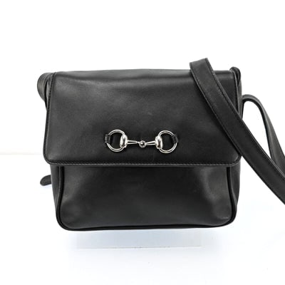 Gucci black leather 1955 Horse-bit cross body with a chrome accent: For sale is a Tom Ford era Gucci, 1955 Horse-bit, black leather and suede cross body or shoulder bag with an adjustable strap, chrome horse bit accent, envelope top, and magnetic snap closure! It is a