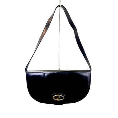 Vintage, rare, black leather, Gucci shoulder bag with a large, two-tone 'GG' emblem and removable: RECENTLY RE-RELEASED BY GUCCI!For sale is a vintage, rare, black leather, Gucci shoulder bag with a large, two-tone 'GG' emblem and removable strap! It is a rare style and that is even more rare in le