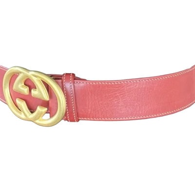 Gucci red leather belt w Gucci Interlocking GG logo buckle: For sale is a Gucci, size 70/28, red leather belt with the classic Gucci GG logo buckle, a hook that slides into a hole to secure it, and holes at 27" to 29"! The belt is classic yet very eye-catching