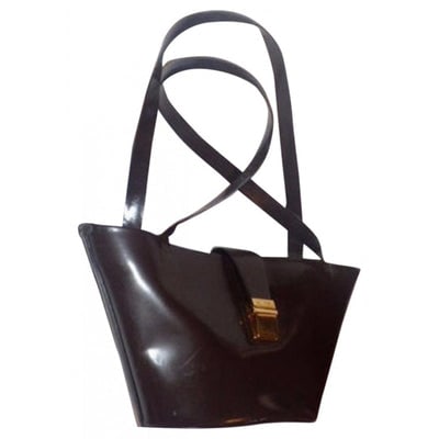 brown patent leather moschino handbag: For sale is a vintage, AMAZING, Moschino, brown patent leather, retro, top handle style, two straps, satchel with flap buckle closure and gold hardware! This handbag is inspired by the style trends