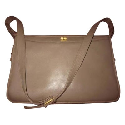 Unique vintage Givenchy taupe leather shoulder bag: For sale is a unique, Givenchy, taupe leather shoulder bag with lots of compartments, top zip, & an adjustable strap! It is a unique, very mod style that would be great used as your signature purs