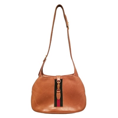 Rare, vintage, Gucci, camel leather 1961 Jackie hobo shoulder bag with a red & green center stripe,: ** Gucci has recently re-released this style! ** For sale is a rare, vintage, Gucci, unique, 1961 Jackie- O style, hobo style shoulder bag made of glossy camel leather with a gold piston closure over 