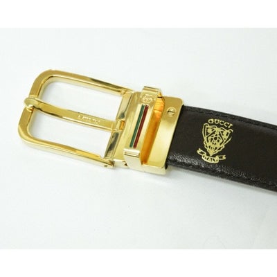 Vintage, NOS, Gucci, brown or black leather, 38" - 42", reversible belt with a removable,: For sale is a vintage, NOS, Gucci, brown or black leather, 38" - 42", reversible belt with a removable, rectangular, gold tone buckle with red and green enamel in engraved stripes, five belt holes, ea