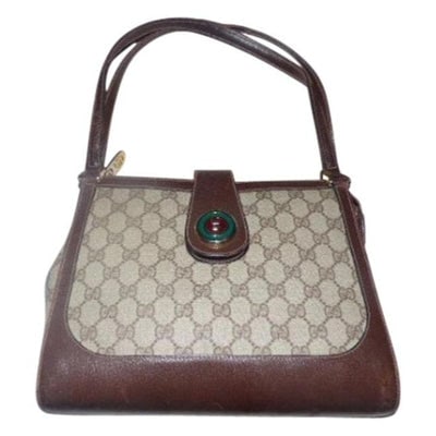 Gucci Vintage Satchelsdesigner Purses Shades Of Brown With Large G Logo Print Leathercoated Canvas S: * ONE OF A KIND GUCCI STYLE! *For sale is an early, rare, GUCCI, 1973 line, brown Guccissima print coated canvas and brown leather, two handle, satchel/tote bag with a round, red and green enamel GG l
